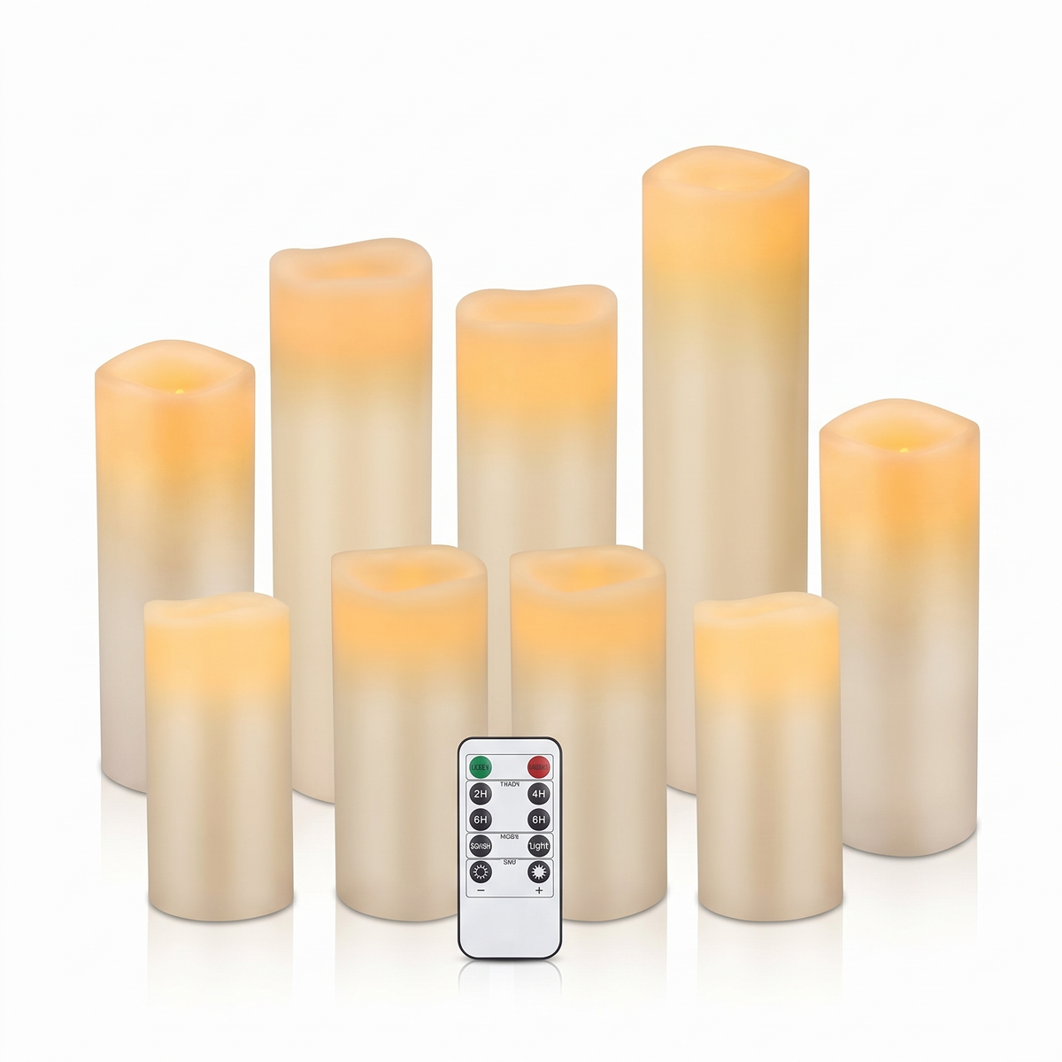 Set of ivory real wax flameless LED pillar candles with remote on a white background